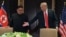 Donald Trump y Kim Jong Un en Sentosa.